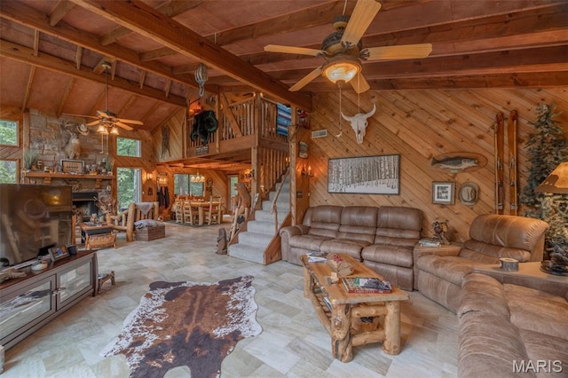 483 Hummingbird View Dr, Innsbrook, MO 63390 - living room featuring ceiling fan, wooden walls, stairway, high vaulted ceiling, and a wood ceiling with exposed beams