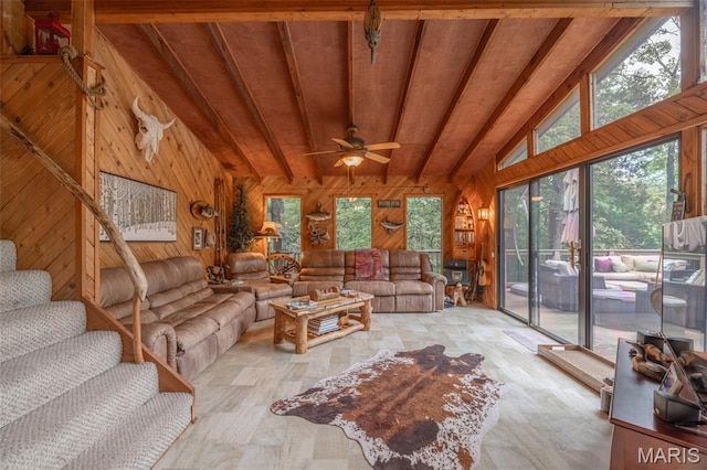 483 Hummingbird View Dr, Innsbrook, MO 63390 - living room with wooden walls, plenty of natural light, wood finished floors, wood ceiling, and a ceiling fan