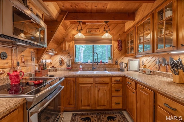 483 Hummingbird View Dr, Innsbrook, MO 63390 - kitchen featuring appliances with stainless steel finishes, brown cabinets, wood walls, glass insert cabinets, and a wooden ceiling with exposed beams