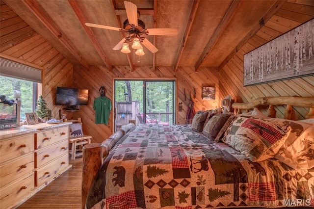 483 Hummingbird View Dr, Innsbrook, MO 63390 - bedroom featuring wooden walls, wood-type flooring, access to exterior, and a wood ceiling with exposed beams