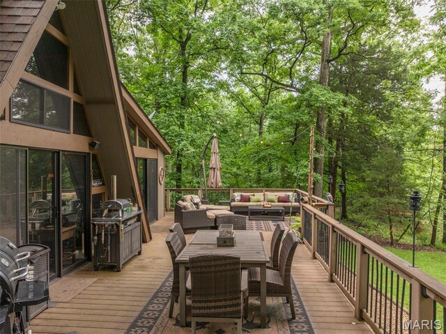 483 Hummingbird View Dr, Innsbrook, MO 63390 - wooden deck featuring an outdoor living space and outdoor dining area