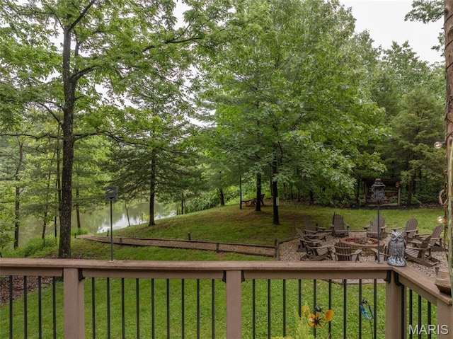 483 Hummingbird View Dr, Innsbrook, MO 63390 - view of green lawn with a water view and a fire pit