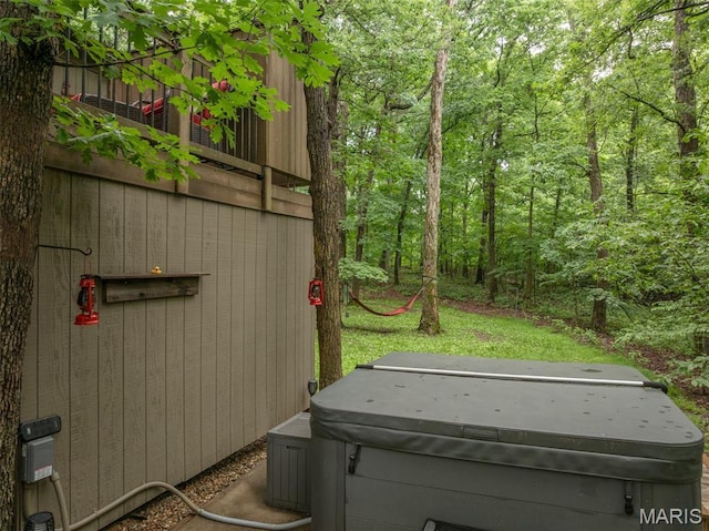 483 Hummingbird View Dr, Innsbrook, MO 63390 - exterior space with a jacuzzi and a forest