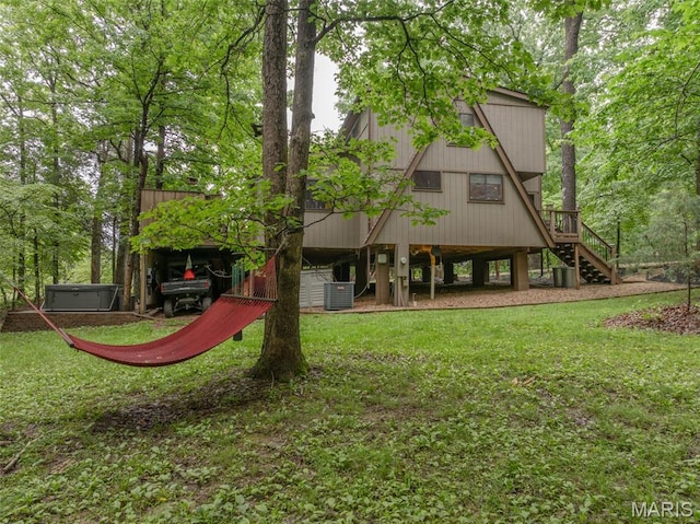 483 Hummingbird View Dr, Innsbrook, MO 63390 - back of property featuring stairs and a yard