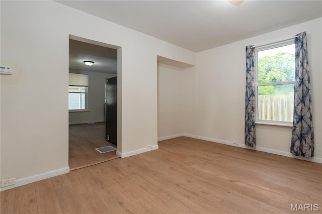 2428 E 25th St, Granite City, IL 62040 - empty room with light wood-style floors and baseboards