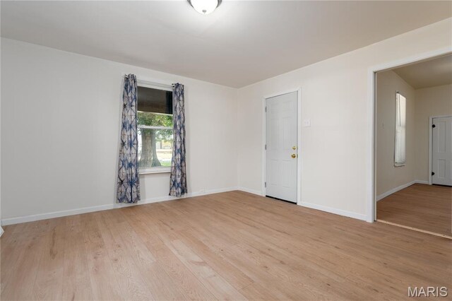 2428 E 25th St, Granite City, IL 62040 - unfurnished room with light wood finished floors and baseboards