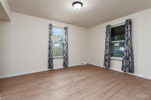 2428 E 25th St, Granite City, IL 62040 - empty room featuring wood finished floors and baseboards
