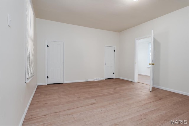 2428 E 25th St, Granite City, IL 62040 - unfurnished bedroom with light wood finished floors and baseboards