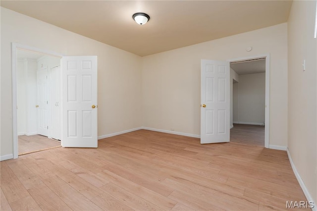 2428 E 25th St, Granite City, IL 62040 - empty room featuring light wood-type flooring and baseboards