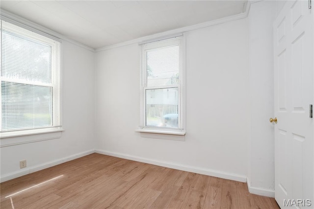 2428 E 25th St, Granite City, IL 62040 - unfurnished room with light wood finished floors, crown molding, and baseboards