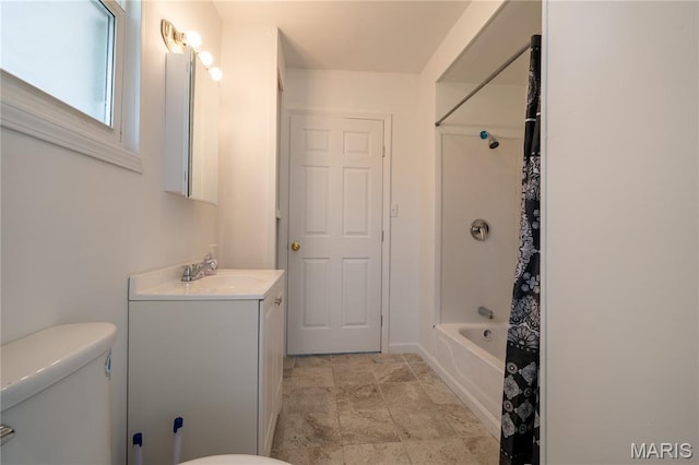 2428 E 25th St, Granite City, IL 62040 - bathroom with toilet, vanity, shower / tub combo, and stone finish floors
