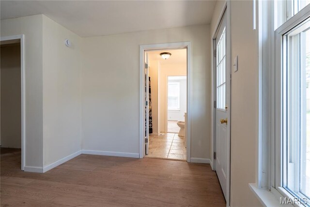 2428 E 25th St, Granite City, IL 62040 - corridor featuring healthy amount of natural light, wood finished floors, and baseboards