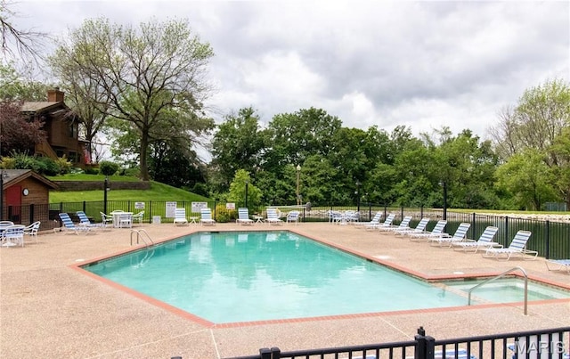 408 Kipling Way Unit A, Weldon Spring, MO 63304 - community pool with a patio area and view of wooded area