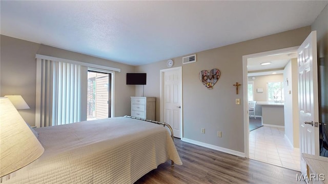 408 Kipling Way Unit A, Weldon Spring, MO 63304 - bedroom featuring wood finished floors and baseboards