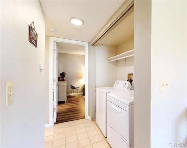 408 Kipling Way Unit A, Weldon Spring, MO 63304 - laundry room featuring washer and dryer and light tile patterned floors