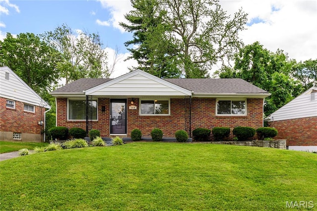 7870 Trenton Ave, University City, MO 63130 - view of front facade with a front lawn, brick siding, and roof with shingles