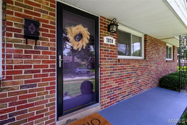 7870 Trenton Ave, University City, MO 63130 - entrance to property with a porch and brick siding