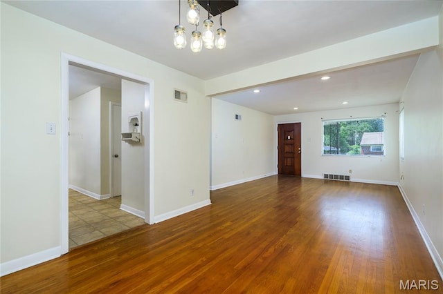 7870 Trenton Ave, University City, MO 63130 - unfurnished room with wood finished floors and recessed lighting