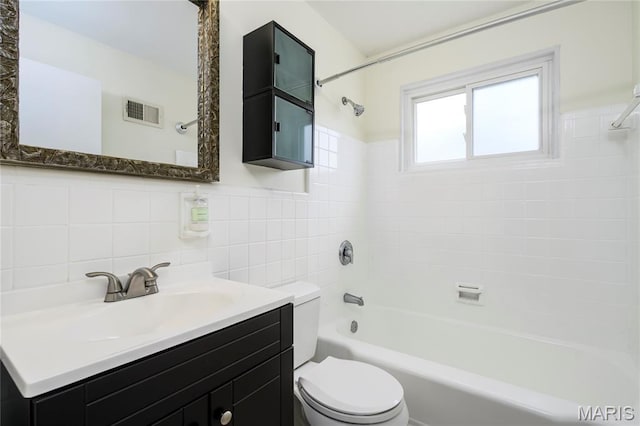 7870 Trenton Ave, University City, MO 63130 - bathroom with tile walls, vanity, and bathing tub / shower combination