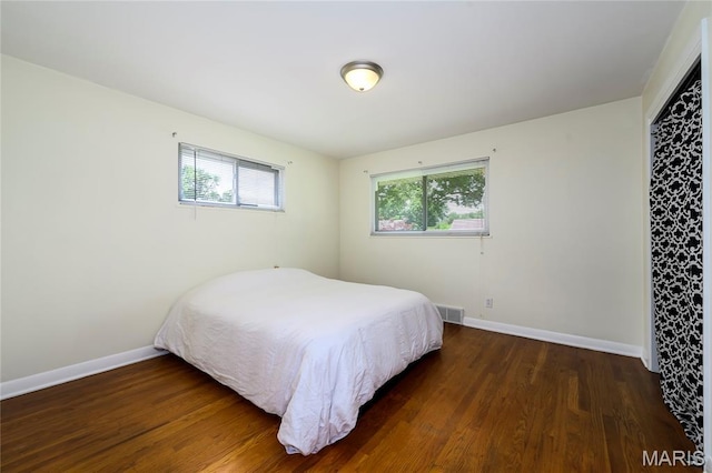 7870 Trenton Ave, University City, MO 63130 - bedroom with wood finished floors and baseboards