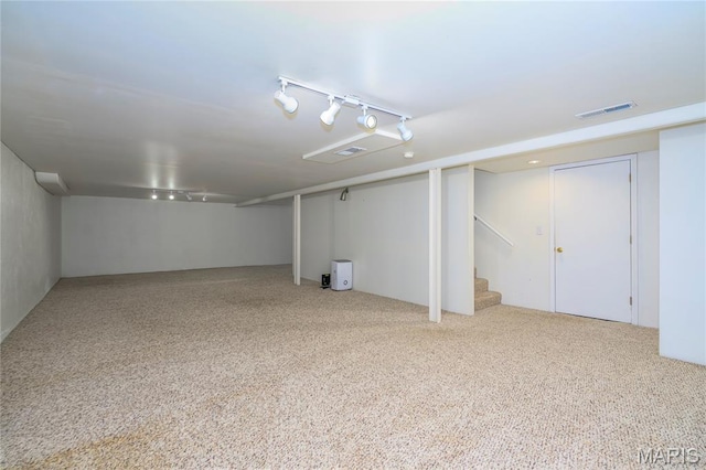 7870 Trenton Ave, University City, MO 63130 - finished basement featuring track lighting, carpet floors, and stairs