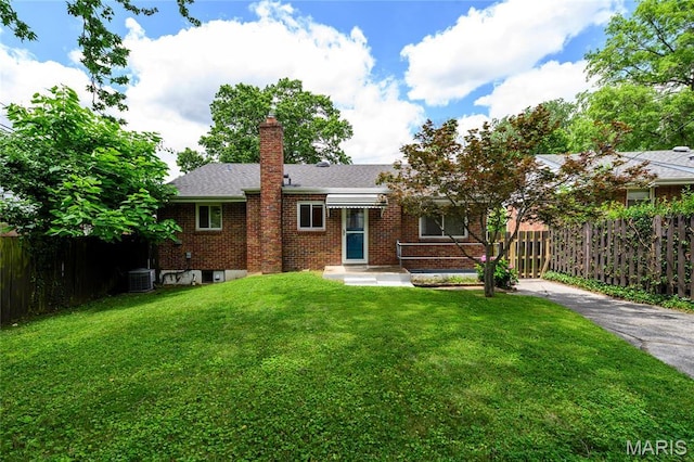 7870 Trenton Ave, University City, MO 63130 - view of front of house with brick siding, a chimney, roof with shingles, and driveway