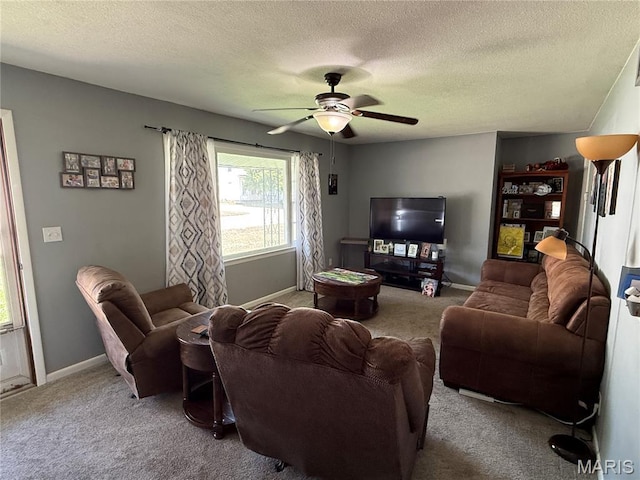 205 S 6th, Shelbina, MO 63468 - living room with carpet, a textured ceiling, a ceiling fan, and baseboards