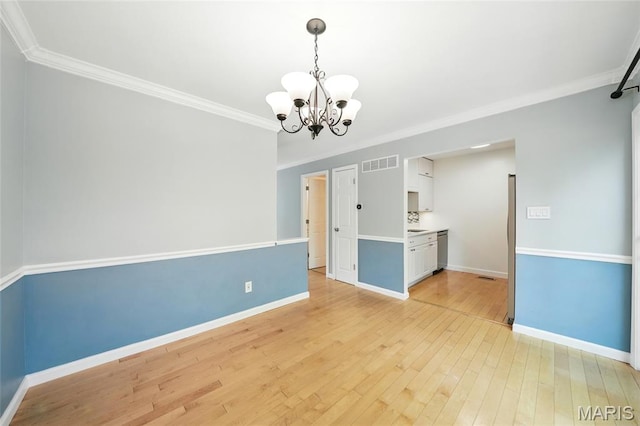 811 Wendevy Ct, Ballwin, MO 63011 - unfurnished room with a chandelier, light wood finished floors, and ornamental molding