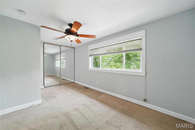 811 Wendevy Ct, Ballwin, MO 63011 - unfurnished bedroom featuring carpet flooring, a closet, and a ceiling fan