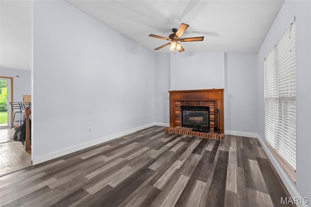 1203 Summerwood Dr, Saint Peters, MO 63376 - unfurnished living room featuring wood finished floors, ceiling fan, a brick fireplace, and lofted ceiling