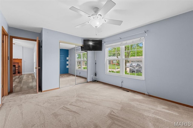 1203 Summerwood Dr, Saint Peters, MO 63376 - unfurnished bedroom with carpet flooring, a closet, and a ceiling fan