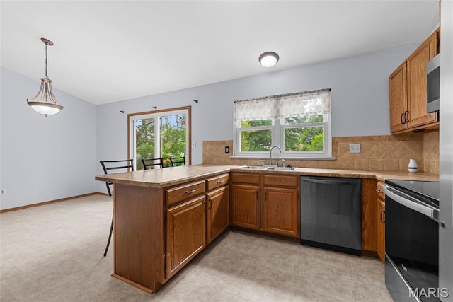 1203 Summerwood Dr, Saint Peters, MO 63376 - kitchen featuring stainless steel appliances, brown cabinets, healthy amount of natural light, and light countertops