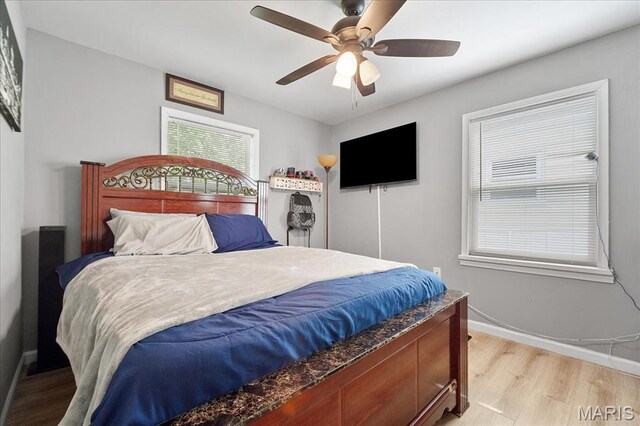 135 Anabel Ave, Saint Louis, MO 63135 - bedroom with light wood-style floors, baseboards, and ceiling fan