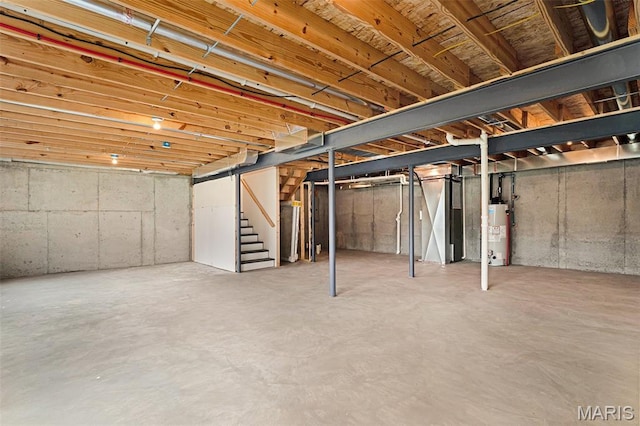 685 Fox Creek Dr, Fenton, MO 63026 - unfinished basement with gas water heater and stairway