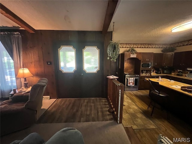 32 Bobwhite Ln, Troy, MO 63379 - foyer featuring beamed ceiling, dark wood-style flooring, and a textured ceiling