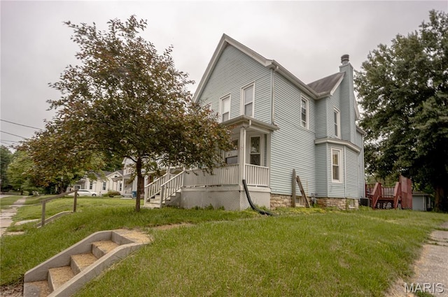 2441 Sanford Ave, Alton, IL 62002 - view of side of home featuring a chimney and a lawn
