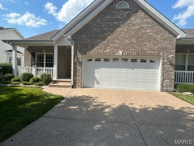 265 Strayhorn Dr, Saint Peters, MO 63376 - view of front of home featuring brick siding, a garage, a porch, and concrete driveway