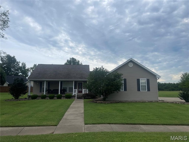 1036 Red Arrow, Sikeston, MO 63801 - view of front of house featuring a porch and a front lawn