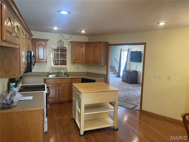 1036 Red Arrow, Sikeston, MO 63801 - kitchen with white electric range oven, open shelves, dark wood-type flooring, recessed lighting, and brown cabinetry