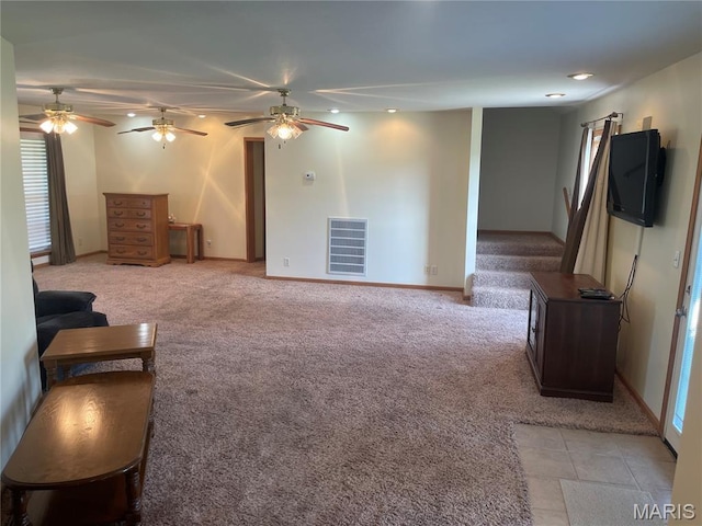 1036 Red Arrow, Sikeston, MO 63801 - unfurnished living room with light carpet, ceiling fan, and plenty of natural light
