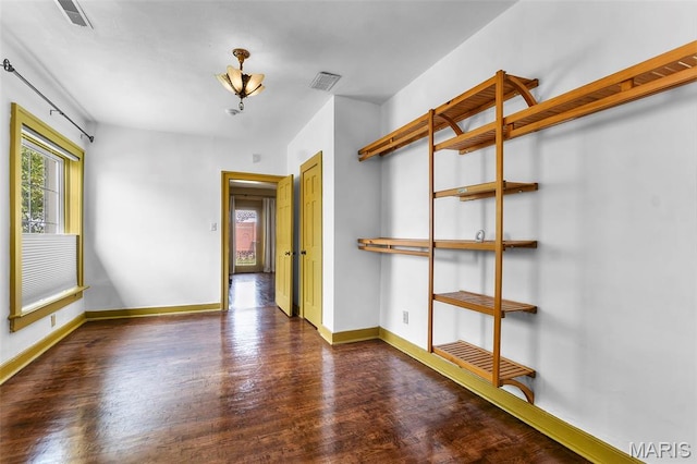 309 S Spanish Cpe, Girardeau, MO 63701 - empty room with wood finished floors and baseboards