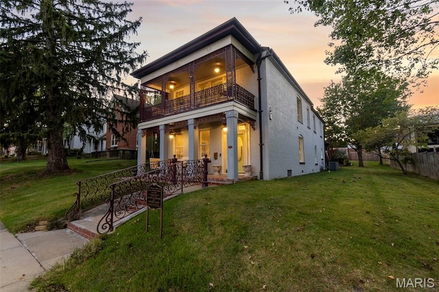 309 S Spanish Cpe, Girardeau, MO 63701 - back of house featuring a balcony, covered porch, brick siding, and central air condition unit