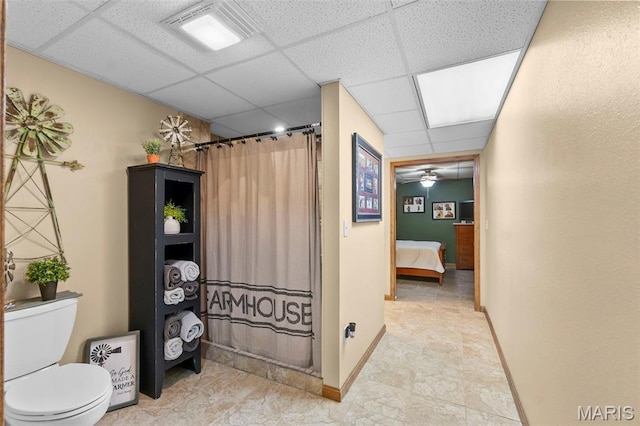 277 Althaea Ln, Jackson, MO 63755 - ensuite bathroom with a paneled ceiling, toilet, baseboards, and a shower with curtain