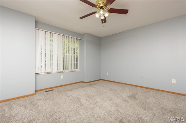 11256 Liberty Landing Dr, Florissant, MO 63033 - empty room featuring carpet flooring, baseboards, and a ceiling fan
