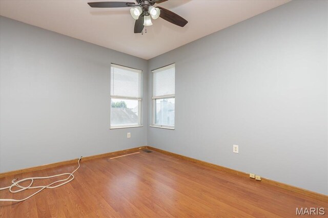 11256 Liberty Landing Dr, Florissant, MO 63033 - spare room with a ceiling fan, baseboards, and wood finished floors