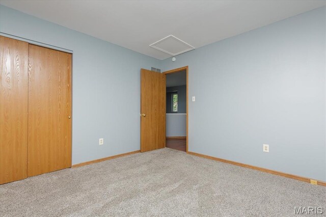 11256 Liberty Landing Dr, Florissant, MO 63033 - unfurnished bedroom featuring carpet flooring, baseboards, and a closet