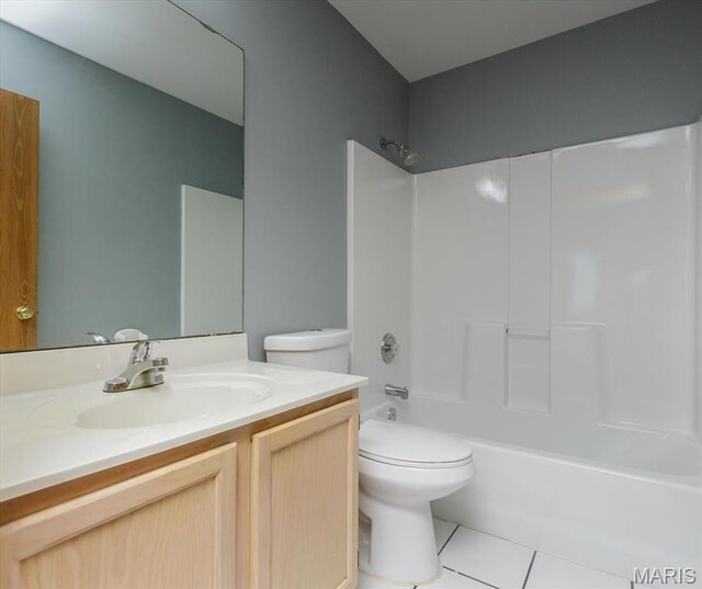 11256 Liberty Landing Dr, Florissant, MO 63033 - bathroom featuring tile patterned floors, toilet, vanity, and bathtub / shower combination