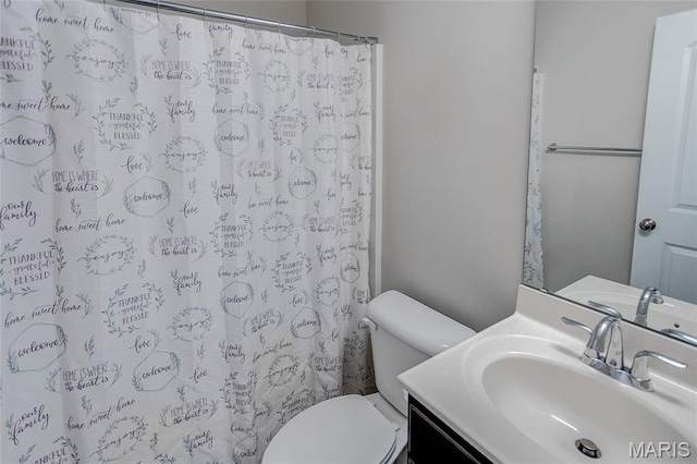 308 Ganim Dr, Shiloh, IL 62221 - full bathroom featuring toilet, vanity, and curtained shower