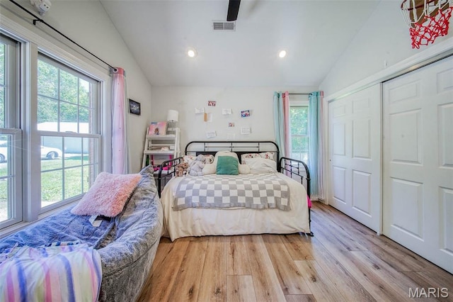 10660 Fawn Rdg, Rolla, MO 65401 - bedroom featuring lofted ceiling, multiple windows, light wood finished floors, recessed lighting, and a closet