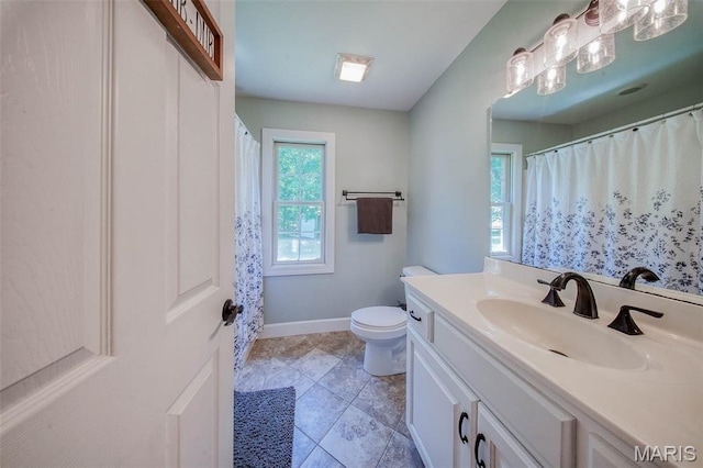 10660 Fawn Rdg, Rolla, MO 65401 - bathroom with vanity, toilet, and baseboards